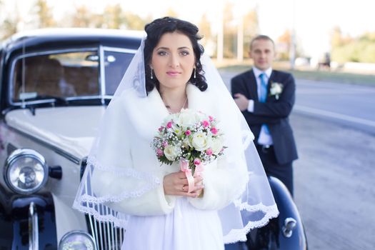 The bride and groom in wedding day for a walk