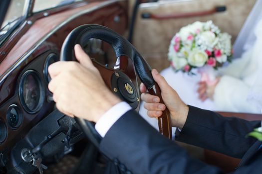 The groom gently hug the bride's hands