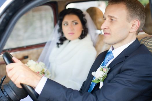 The bride and groom in wedding day for a walk