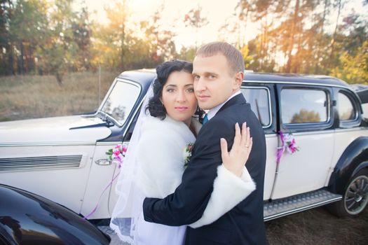 The bride and groom in wedding day for a walk