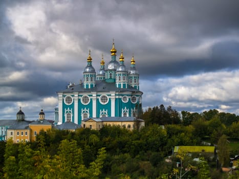 Autumn urban landscape with an orthodox temple with a gloomy autumn sky