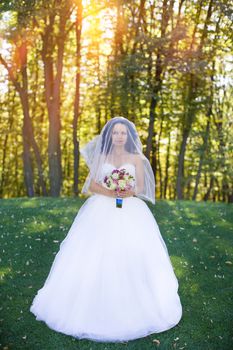 portrait of a brown-eyed sensual kinky girl in white dress on the window background, close up