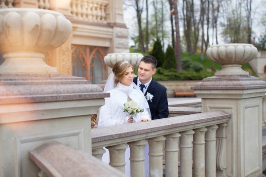 happy beautiful bride and groom walking on field. Loving wedding couple outdoor. Bride and groom.Wedding concept.