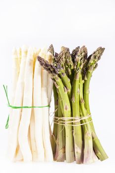 heap of green and white asparagus  vegetables isolated on white background.