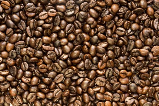 the texture of the coffee beans roasted Brown background