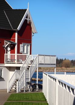 Summer house at lake with bike and lawn