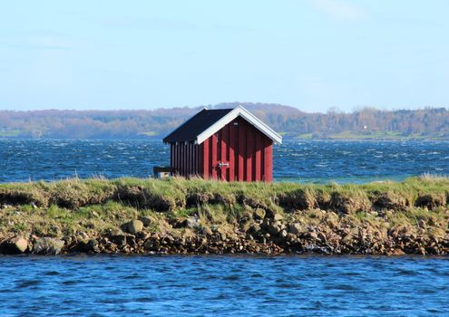 Swimmers dressing house at lake in Denmark