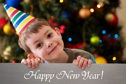 Happy New Year 2016 - boy on a Christmas tree background with inscription