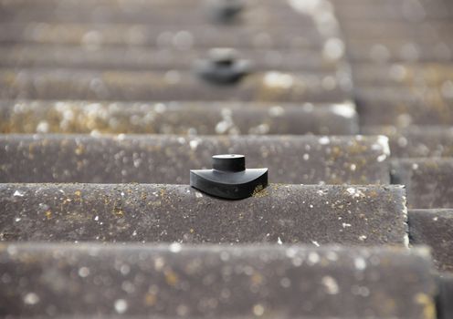 Screw protection stud on asbestos roof