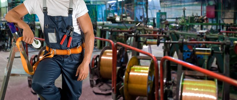 Worker with instruments at industrial factory