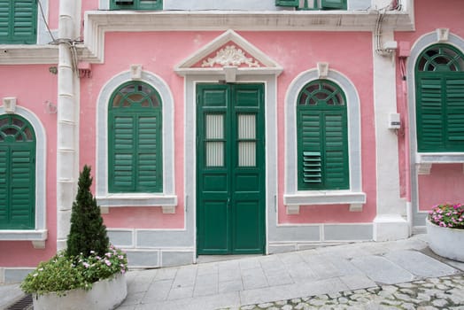 The traditional quaint houses in pink Portugal style and vintage.