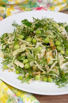 Coleslaw with cucumbers and peas, seasoned with dijon mustard and dill