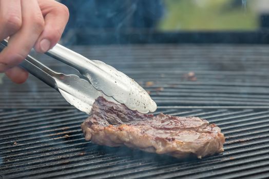 Two t-bone florentine beef steaks on the grill