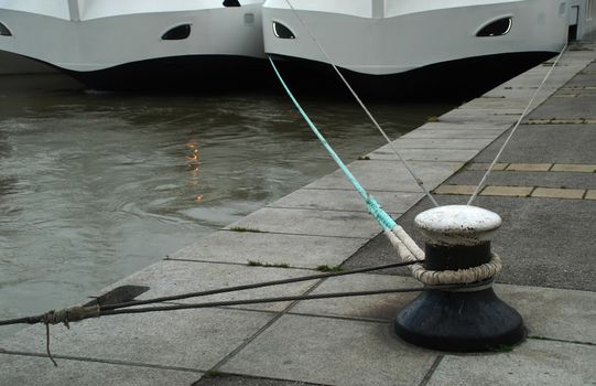 stock pictures of ships moored in a harbor with lines