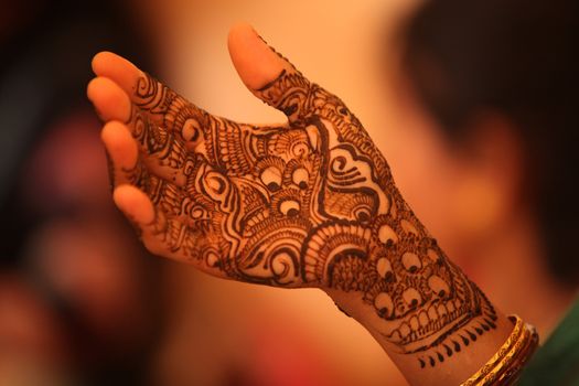 Beautiful design with traditional patterns of henna or mehendi as it is called on the hand of an Indian bride.