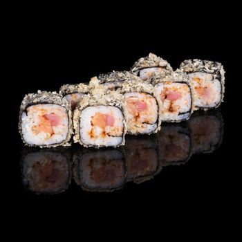 Grilled sushi rolls with salmon, tuna and eel on black background