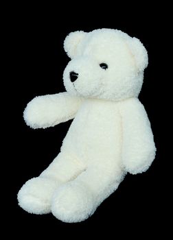 Image of toy teddy bear on black background