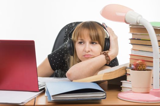 Student thinking sadly looks at the laptop screen