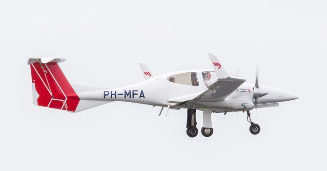 LEEUWARDEN, THE NETHERLANDS - JUNE 11, 2016: Martinair Flight Academy prop plane during a demonstration at the Royal Netherlands Air Force Days