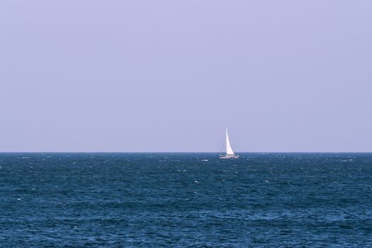 The sail boat on Mediterranean blue sea