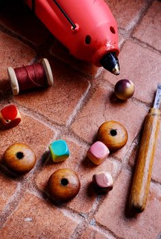 Glue gun for crafts,beads,decor and tools on a brick background