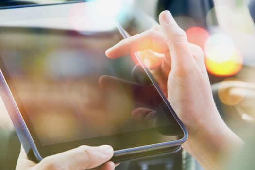 close up image of business women Sitting in the Car and Using digital tablet.