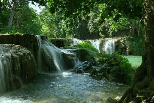 panorama view of nice waterfall and pond  in green tropic environment