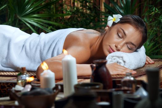 portrait of young beautiful woman in spa environment