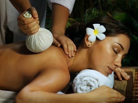 portrait of young beautiful woman in spa environment