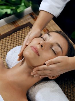 portrait of young beautiful woman in spa environment.