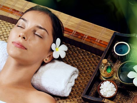 portrait of young beautiful woman in spa environment