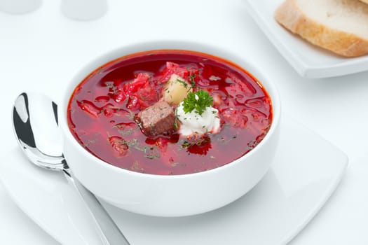 close up view of nice yummy red russian soup on white back