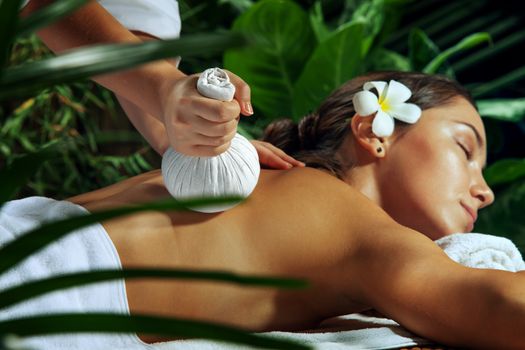 portrait of young beautiful woman in spa environment