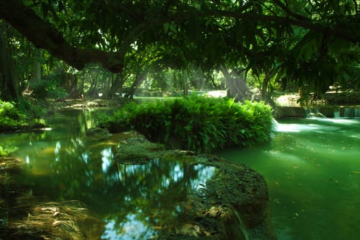 panorama view of nice waterfall and pond in green tropic environment