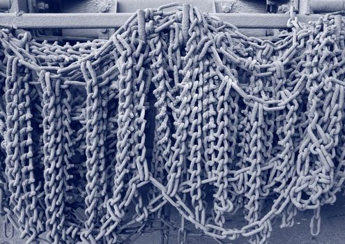 Industrial gray chains hanging on a truck