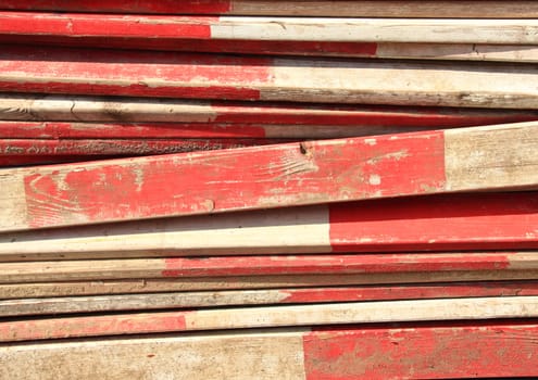 Barrier planks with red and white stripes