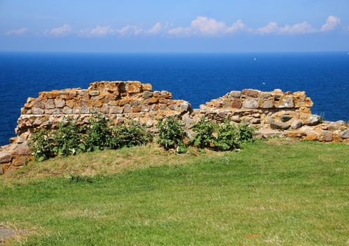 Ancient ruin wall of rocks with horizon