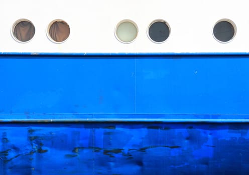 Portholes and hull on white and blue  coaster background