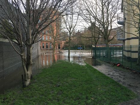 UNITED-KINGDOM, Leeds : Parts of Leeds near the Royal Armouries museum are submerged in flood waters after heavy rainfall hits northern England on December 27, 2015 in West Yorkshire. December 2015 has been the wettest on record for parts of the UK and has seen several communities swamped by rising waters, Met Office figures show. Flood alerts and warnings were issued since the beginning of the month across England and Wales as Storm Desmond, Eva then Frank take hold and bring torrential rain. The leader of Leeds City Council has said the authority had warned the Government that flooding in Leeds was a catastrophe waiting to happen on December 27, 2015. 