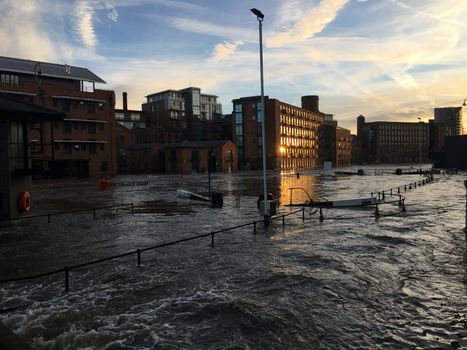 UNITED-KINGDOM, Leeds : Parts of Leeds near the Royal Armouries museum are submerged in flood waters after heavy rainfall hits northern England on December 27, 2015 in West Yorkshire. December 2015 has been the wettest on record for parts of the UK and has seen several communities swamped by rising waters, Met Office figures show. Flood alerts and warnings were issued since the beginning of the month across England and Wales as Storm Desmond, Eva then Frank take hold and bring torrential rain. The leader of Leeds City Council has said the authority had warned the Government that flooding in Leeds was a catastrophe waiting to happen on December 27, 2015. 