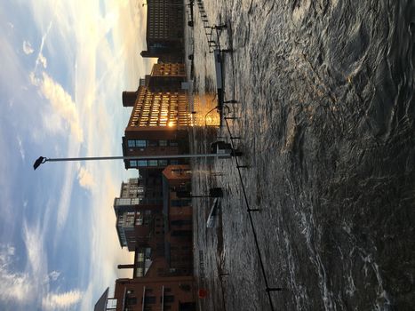 UNITED-KINGDOM, Leeds : Parts of Leeds near the Royal Armouries museum are submerged in flood waters after heavy rainfall hits northern England on December 27, 2015 in West Yorkshire. December 2015 has been the wettest on record for parts of the UK and has seen several communities swamped by rising waters, Met Office figures show. Flood alerts and warnings were issued since the beginning of the month across England and Wales as Storm Desmond, Eva then Frank take hold and bring torrential rain. The leader of Leeds City Council has said the authority had warned the Government that flooding in Leeds was a catastrophe waiting to happen on December 27, 2015. 