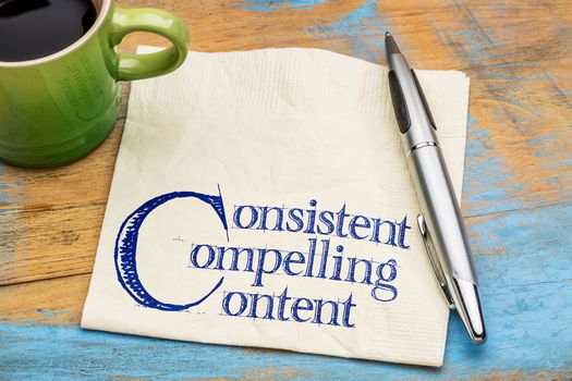 consistent, compelling content -  advice for bloging and social media marketing -  handwriting on a napkin with cup of coffee