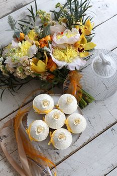 Beautiful cakes and bridal bouquet in orange tones