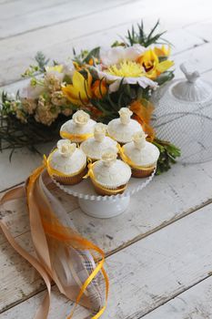 Beautiful cakes and bridal bouquet in orange tones