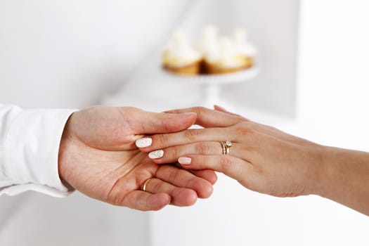 The groom keep the bride for hands