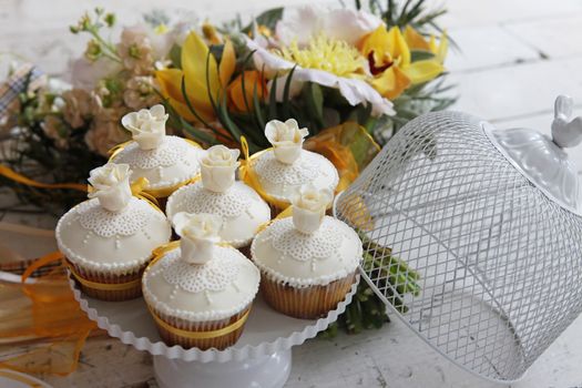 Beautiful cakes and bridal bouquet in orange tones