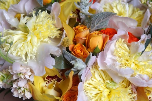 Wedding bouquet of roses, orchids and peonies