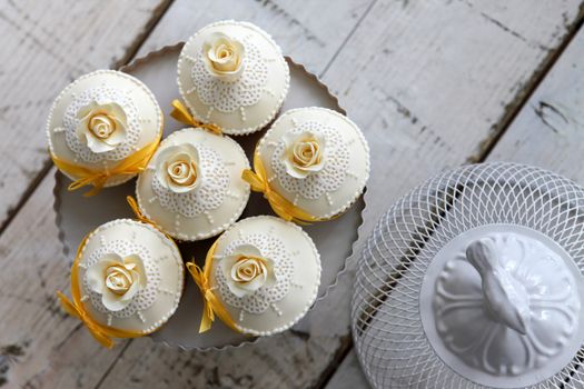 Beautiful cakes and bridal bouquet in orange tones