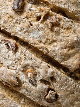 close up of rustic artisan walnut bread crust background