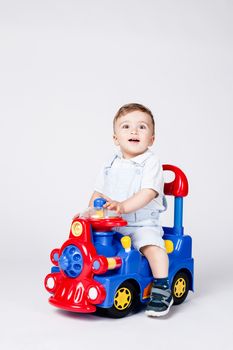 baby boy playing with a toy truck